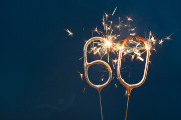 60 years celebration festive background made with Bengal fires in the form of number Sixty.