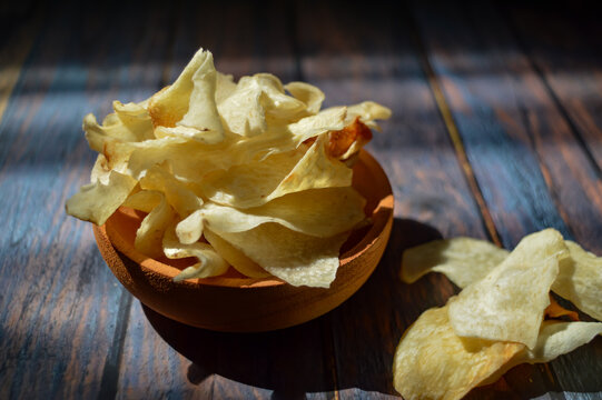 Keripik talas or taro chips is made of deep fried thin slice taro . Crispy savory snack. Typical Indonesian traditional chips.