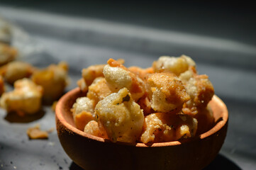 Snack on dry dumplings or  siomay cikruh. Made from dumpling skin and tapioca flour which are fried and seasoned.