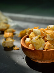 Snack on dry dumplings or  siomay cikruh. Made from dumpling skin and tapioca flour which are fried and seasoned.