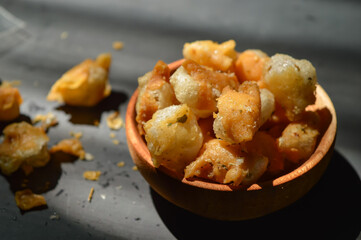 Snack on dry dumplings or  siomay cikruh. Made from dumpling skin and tapioca flour which are fried and seasoned.