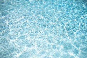 Fototapeta premium Background of pool water surface. Abstract blue water. Background texture. Water in swimming pool. Copy space.
