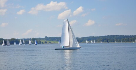 Sailing boats in the Chiemsee lake, Germany. Sailboats and landscape of Chiemsee lake, Bavaria.