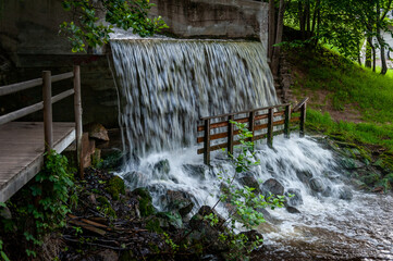 Artificial waterfall in public park.  Vecais parks, Smiltene, Latvia.