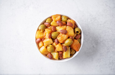 Puerto Rican traditional potato red kidney bean stew in a bowl