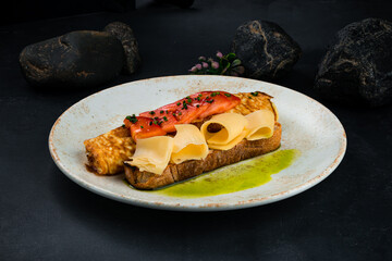 Fresh breakfast omelette with tomatoes, cheese and bread.