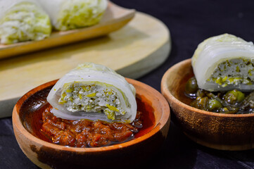 Sawi gulung tahu or rolled Chinese cabbage with tofu. Served with red chilli sauce and green chilli sauce.
