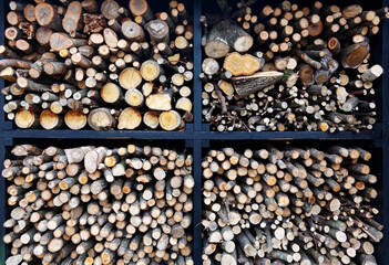 Close up view of logs are stacked together to form a tall pile of firewood for the winter, stacks of firewood, piles of firewood, firewood background 
Calm and tranquil, giving a warm and homely feel