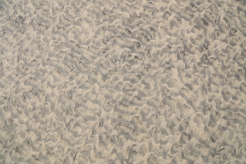 Beach sand background with patterns and texture.