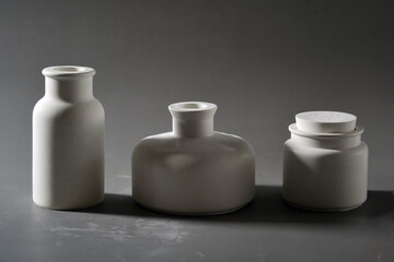 Ceramic vases on a gray background. Studio photography
