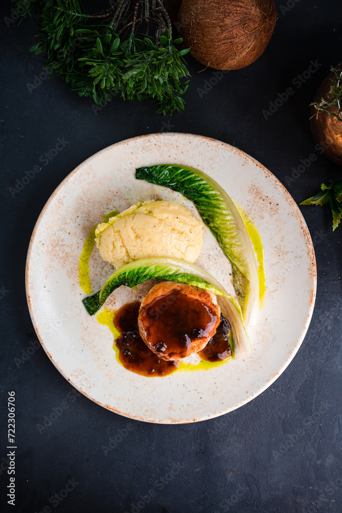 Wall mural fresh chicken cutlet with mashed potatoes, greens and sauce.