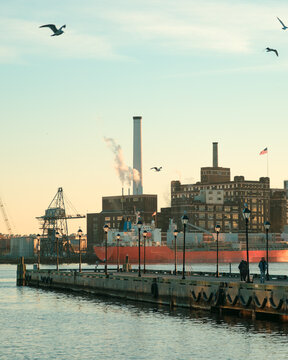 Pier and view of the Domino Sugar Factory, Fells Point, Baltimore, Maryland