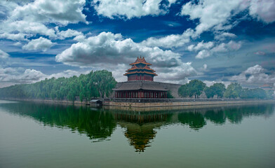 Fototapeta premium Serene Reflections of the Watchtower at the Forbidden City Moat, Beijing
