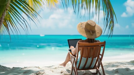 Employee sitting on beach with laptop for remote work - obrazy, fototapety, plakaty