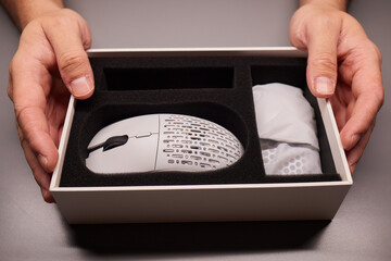 white new wireless computer mouse flat lay with led lights