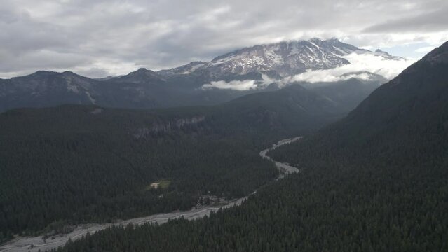 Ungraded 4k wide-angle aerial footage of Mt. Rainier on a cloudy day in Washington State.