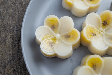 Kue nagasari or Nogosari cake. served on a plate, nagasari is a very popular type of traditional wet cake. top view food. 