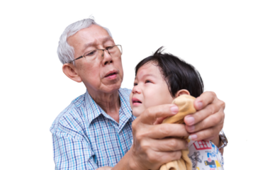 Grandfather Comforting Crying Child with Towel. Elderly Asian man soothing a young tearful child with a gentle touch and a soft towel, moments of family care and affection.