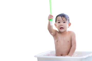 Toddler Playing with Water in Bath Time Fun. Cheerful Asian Baby Boy enjoying teke a shower, playfully lifting a water toy, splashing and having fun with water droplets in the air. Child aged 3 years.