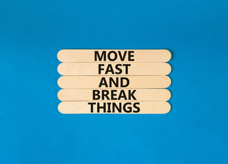 Move fast and break things symbol. Concept words Move fast and break things on wooden stick. Beautiful blue table blue background. Business, move fast and break things concept. Copy space.