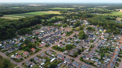 Aerial drone view of homes, houses and apartments in Havelte, Drenthe, The Netherlands. Residential area neighborhood architecture captured from above.