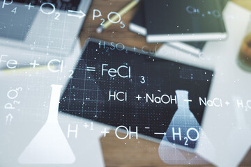 Double exposure of creative chemistry concept and digital tablet on background, top view, research and development concept
