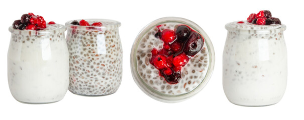 Set of yogurt jars with chia seeds, granola, oatmeal and berries in a glass jar. On a blank...