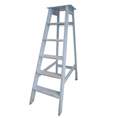old wooden stepladder for repair work painted with blue paint
