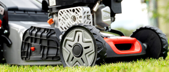 lawn mower on a freshly mowed flat lawn