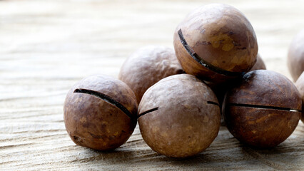 macadamia nuts on a wooden background