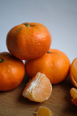 tangerines on a wooden board