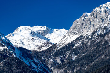 snow covered mountains under a clear blue sky - 722374197