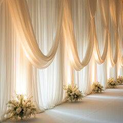Wedding decorations, crisp white linen fabric, elegantly draped with natural folds. Flowers nearby