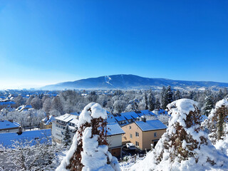 white city Maribor and Pohorje mountain. Covered by snow. Winter season. Slovenia