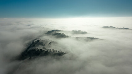 Italy, January 28, 2024: aerial view of the San Bartolo park immersed in autumn fog. We are near...