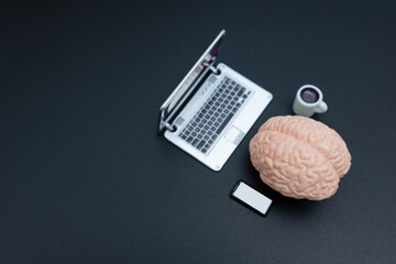 Digital Workspace: Brain with Phone and Coffee at Laptop