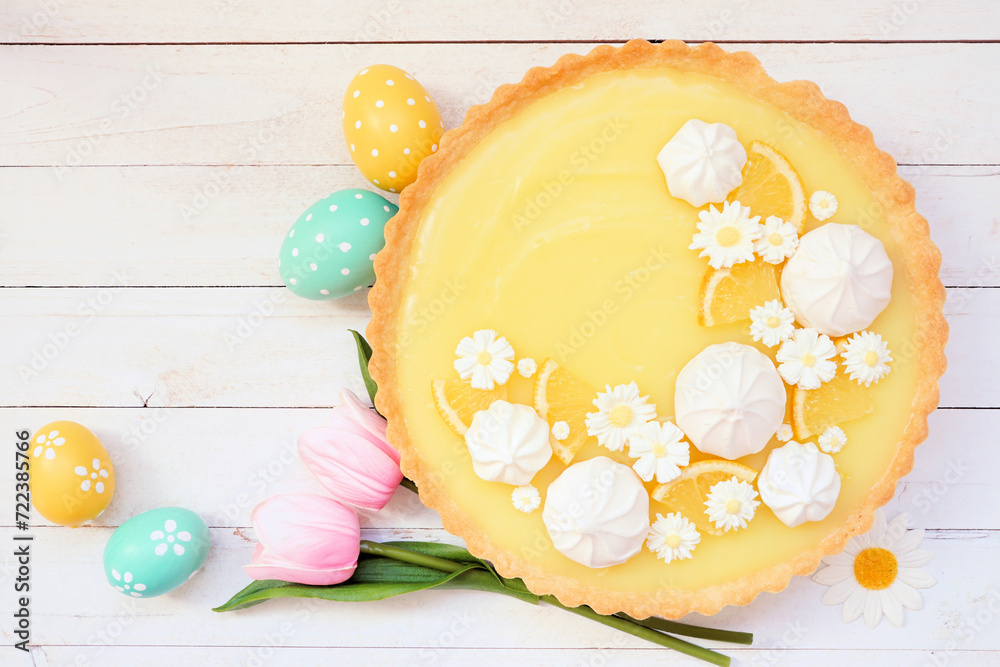Aufkleber spring lemon tart with white chocolate flowers and meringue. easter dessert concept. top view table 