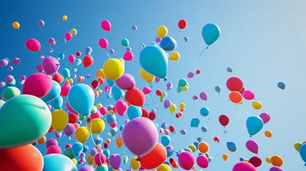 Foto op Canvas Colorful balloons flying in the blue sky. A whimsical scene of colorful balloons floating against a clear blue sky, creating a festive and joyful atmosphere. The balloons vary in sizes and hues. © Oskar Reschke