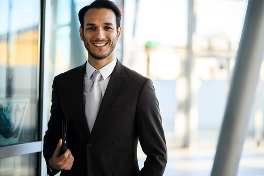 Confident businessman smiling in office building