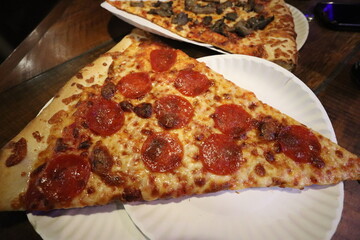 Slice of pizza at a restaurant in downtown Pittsburgh, Pennsylvania. 