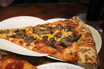 Slice of pizza at a restaurant in downtown Pittsburgh, Pennsylvania. 