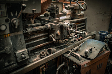 Old dusty metal lathe in metal workshop,haven't been used for a while