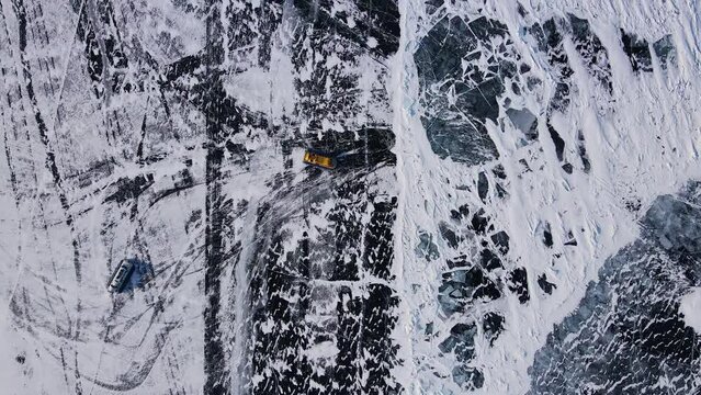 Hovercraft glides over Baikal's ice northern nature's marvel Hovercraft unusual mode transport ice. Hovercraft on lake facing snow frost extreme north Extreme travel exploring icy terrains.