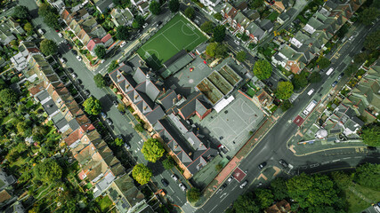 Aerial view from a drone flying above green Brighton streets in summer, East Sussex, UK