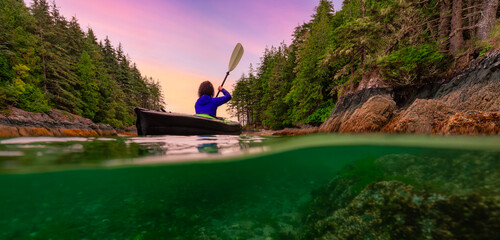 Adventure Woman Kayaking on West Coast of Pacific Ocean.