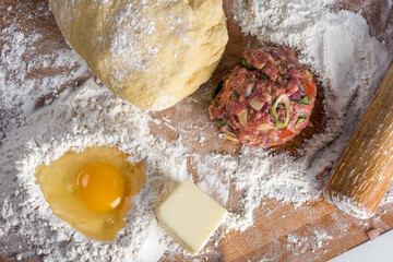 Preparing Homemade Beef Stuffed Empanada with egg - Culinary Delight in Vibrant 4K Ultra HD
