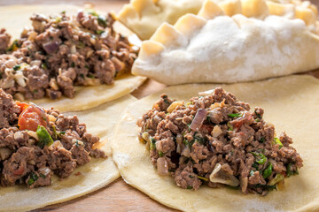 Close-Up of Preparing Homemade Beef Stuffed Empanada - Captivating 4K Ultra HD Image of Culinary...