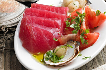 Close-Up of Fresh Tuna Sashimi with Tomato and Scallops - 4K Ultra HD Image of Exquisite Seafood Dish