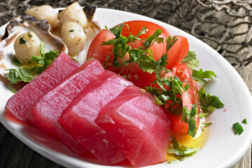 Close-Up of Fresh Tuna Sashimi with Tomato and Scallops - 4K Ultra HD Image of Exquisite Seafood Dish