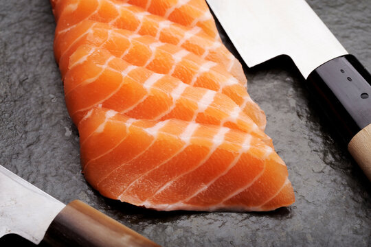 Close-Up of Fresh Salmon Sashimi with Sashimi Knife - 4K Ultra HD Image of Japanese Culinary Art